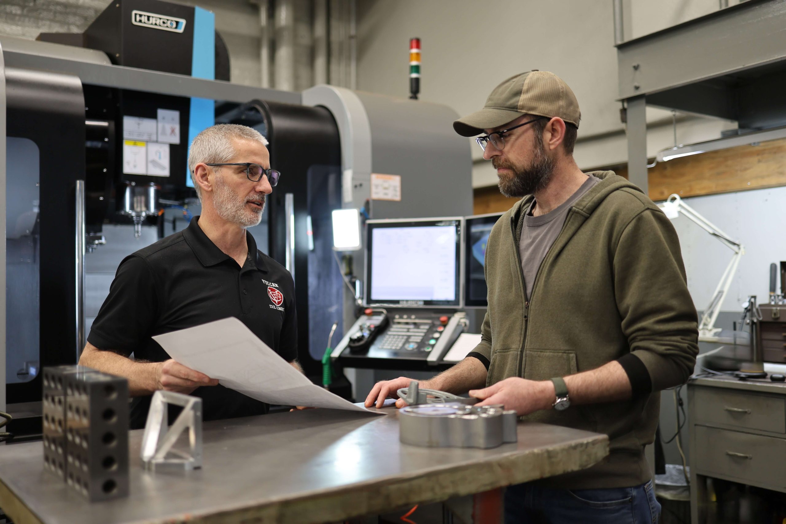 Engineers looking at the print